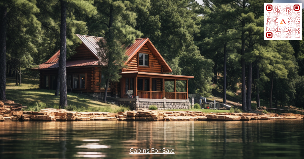 Log Cabin along a lake with trees in the background. A typical log cabin for sale you will see on Airdeed